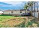 Exterior view of the home and backyard with a small deck and fenced perimeter at 113 Tanager Dr, York, SC 29745