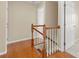 Wood and white staircase features wood railing, stairs to the main level, and an open hallway at 119 Snead Rd, Fort Mill, SC 29715