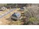 Aerial view of the backyard, covered patio, and neighboring homes and landscaping at 12515 Hashanli Pl, Matthews, NC 28105