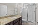 Bathroom featuring granite vanity, tiled floors, and glass shower at 12515 Hashanli Pl, Matthews, NC 28105