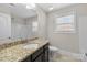 Well-lit bathroom features granite counters, an oval sink, and a shower-tub combo at 12515 Hashanli Pl, Matthews, NC 28105