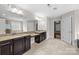 Bright bathroom featuring double vanities and granite countertops at 12515 Hashanli Pl, Matthews, NC 28105