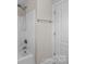 Clean white bathroom with a shower-tub combo and a towel bar near the door at 12515 Hashanli Pl, Matthews, NC 28105