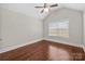 Bedroom featuring hardwood floors and a vaulted ceiling at 12515 Hashanli Pl, Matthews, NC 28105