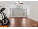 Bedroom with a ceiling fan, hardwood floors, and two windows at 12515 Hashanli Pl, Matthews, NC 28105