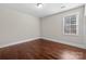 Neutral bedroom with hardwood floors and natural light at 12515 Hashanli Pl, Matthews, NC 28105