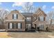 Charming two-story brick and siding home with a manicured lawn and lovely curb appeal at 12515 Hashanli Pl, Matthews, NC 28105