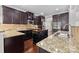 Spacious kitchen featuring granite countertops, stainless appliances, and a center island at 12515 Hashanli Pl, Matthews, NC 28105