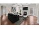 Bright living room features a fireplace, coffered ceilings, and hardwood floors at 12515 Hashanli Pl, Matthews, NC 28105