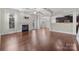 Spacious living room with fireplace, coffered ceiling, and hardwood floors at 12515 Hashanli Pl, Matthews, NC 28105