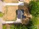 Overhead shot of home featuring a dark gray roof, circular driveway, and lush tree coverage at 1323 Mack Dr, McConnells, SC 29726