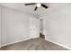 A neutral bedroom with a ceiling fan, three doorways, and carpeted floors at 1323 Mack Dr, McConnells, SC 29726