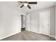 A neutral bedroom with a ceiling fan, three doorways, and carpeted floors at 1323 Mack Dr, McConnells, SC 29726