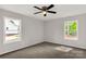 Neutral bedroom with two windows and a modern ceiling fan at 1323 Mack Dr, McConnells, SC 29726