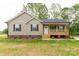 Charming single-story home with a welcoming front porch and manicured lawn at 1323 Mack Dr, McConnells, SC 29726
