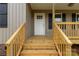 Close-up of a newly-built front porch featuring fresh wood and classic design elements at 1323 Mack Dr, McConnells, SC 29726