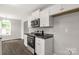 Modern kitchen featuring stainless steel appliances, granite countertops, and white cabinets at 1323 Mack Dr, McConnells, SC 29726