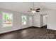 Spacious living room boasts neutral walls, ceiling fan, and hardwood floors at 1323 Mack Dr, McConnells, SC 29726