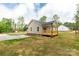 Side view of a cozy home with a well-kept yard and inviting back porch at 1323 Mack Dr, McConnells, SC 29726
