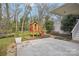 Spacious backyard with wooden playhouse and manicured landscaping at 138 Lansdowne Rd, Charlotte, NC 28270