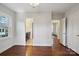 Bedroom with hardwood floors, a window, access to an ensuite bathroom, and a closet at 138 Lansdowne Rd, Charlotte, NC 28270