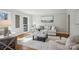 Bright living room featuring hardwood floors, crown molding, and a comfortable seating area at 138 Lansdowne Rd, Charlotte, NC 28270