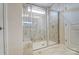 Elegant bathroom featuring a glass-enclosed shower with marble-look tile and a built-in bench at 1471 Honey Trl, Monroe, NC 28112
