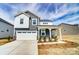 Charming two-story home featuring a two-car garage and covered front porch at 1471 Honey Trl, Monroe, NC 28112