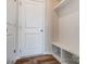 Mudroom with convenient storage bench and shelving, providing an organized entryway with durable flooring and a clean aesthetic at 1471 Honey Trl, Monroe, NC 28112