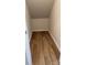 Walk-in closet with wood look floors and shelving at 1471 Honey Trl, Monroe, NC 28112