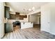 Modern kitchen featuring stainless steel appliances, granite counters, and tile backsplash at 14730 Tamarack Dr, Charlotte, NC 28278