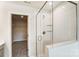 Modern bathroom with a glass shower and view into a large walk-in closet at 14734 Tamarack Dr, Charlotte, NC 28278