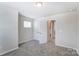 Inviting bedroom featuring a double-door closet and access to an ensuite bathroom at 14734 Tamarack Dr, Charlotte, NC 28278