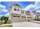Attractive townhome featuring a two-car garage, well-kept lawn, and easy street access at 14734 Tamarack Dr, Charlotte, NC 28278