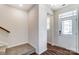 Bright foyer with wood floors, staircase, and an inviting entryway at 14734 Tamarack Dr, Charlotte, NC 28278