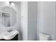 Modern bathroom with updated sink, faucet, mirror and toilet at 152 Painted Bunting Dr, Troutman, NC 28166