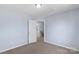Clean, neutral bedroom with a large closet and views of the neighborhood through the open door at 152 Painted Bunting Dr, Troutman, NC 28166