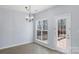 Light-filled dining area with windows and access to back deck at 152 Painted Bunting Dr, Troutman, NC 28166