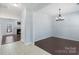 Light-filled dining room features stylish chandelier and hardwood floors at 152 Painted Bunting Dr, Troutman, NC 28166