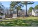 Spacious two-story home with well-maintained lawn, attached garage, and long driveway at 152 Painted Bunting Dr, Troutman, NC 28166