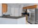 Well-equipped kitchen features stainless steel appliances and convenient breakfast bar at 152 Painted Bunting Dr, Troutman, NC 28166