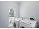 Bright laundry room featuring modern washer and dryer at 152 Painted Bunting Dr, Troutman, NC 28166