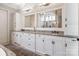 Bathroom featuring a double vanity with granite countertops and modern fixtures at 16824 Ashton Oaks Dr, Charlotte, NC 28278