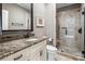 Well-appointed bathroom with granite counters, white cabinets, and a glass-enclosed shower, providing a modern aesthetic at 16824 Ashton Oaks Dr, Charlotte, NC 28278
