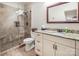 Bathroom with granite countertop vanity and a glass-enclosed tiled shower at 16824 Ashton Oaks Dr, Charlotte, NC 28278