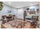 Bright craft room with hardwood floors, sewing table and charming decor at 16824 Ashton Oaks Dr, Charlotte, NC 28278
