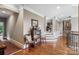 Upstairs hallway with hardwood floors and access to multiple rooms at 16824 Ashton Oaks Dr, Charlotte, NC 28278