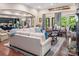 Open-concept living room featuring hardwood floors, stylish furnishings, and seamless flow to the kitchen at 16824 Ashton Oaks Dr, Charlotte, NC 28278