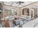 Spacious living room featuring coffered ceilings, hardwood floors, and neutral paint, creating an inviting atmosphere at 16824 Ashton Oaks Dr, Charlotte, NC 28278