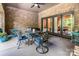 Covered patio with a table, four chairs and sliding glass doors to the interior at 16824 Ashton Oaks Dr, Charlotte, NC 28278